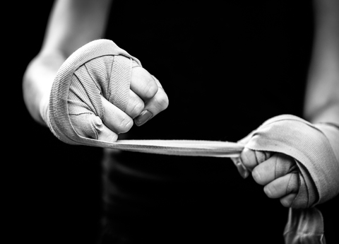 martial arts class in Litchfield and Staffordshire close up of woman's hands in clack and white preparing to train punches